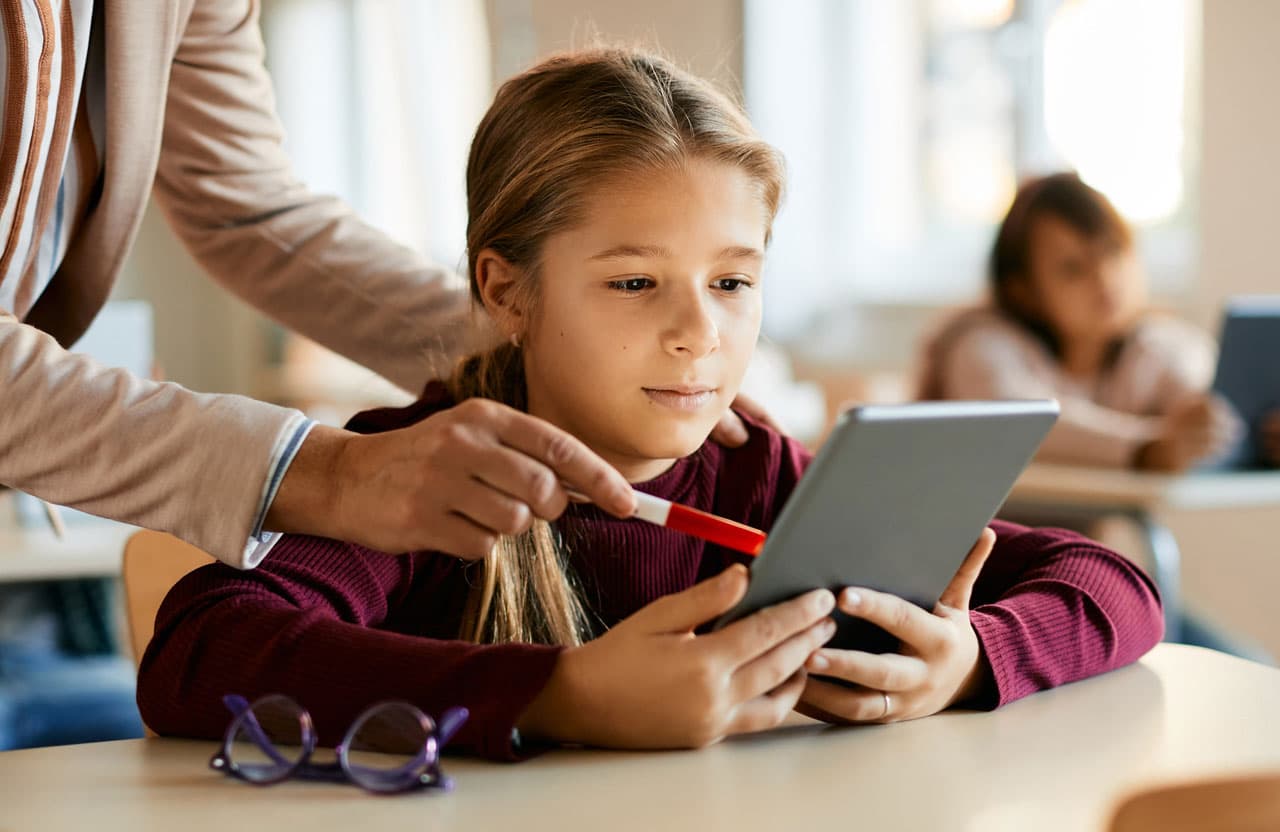 Student using a tablet in a classroom